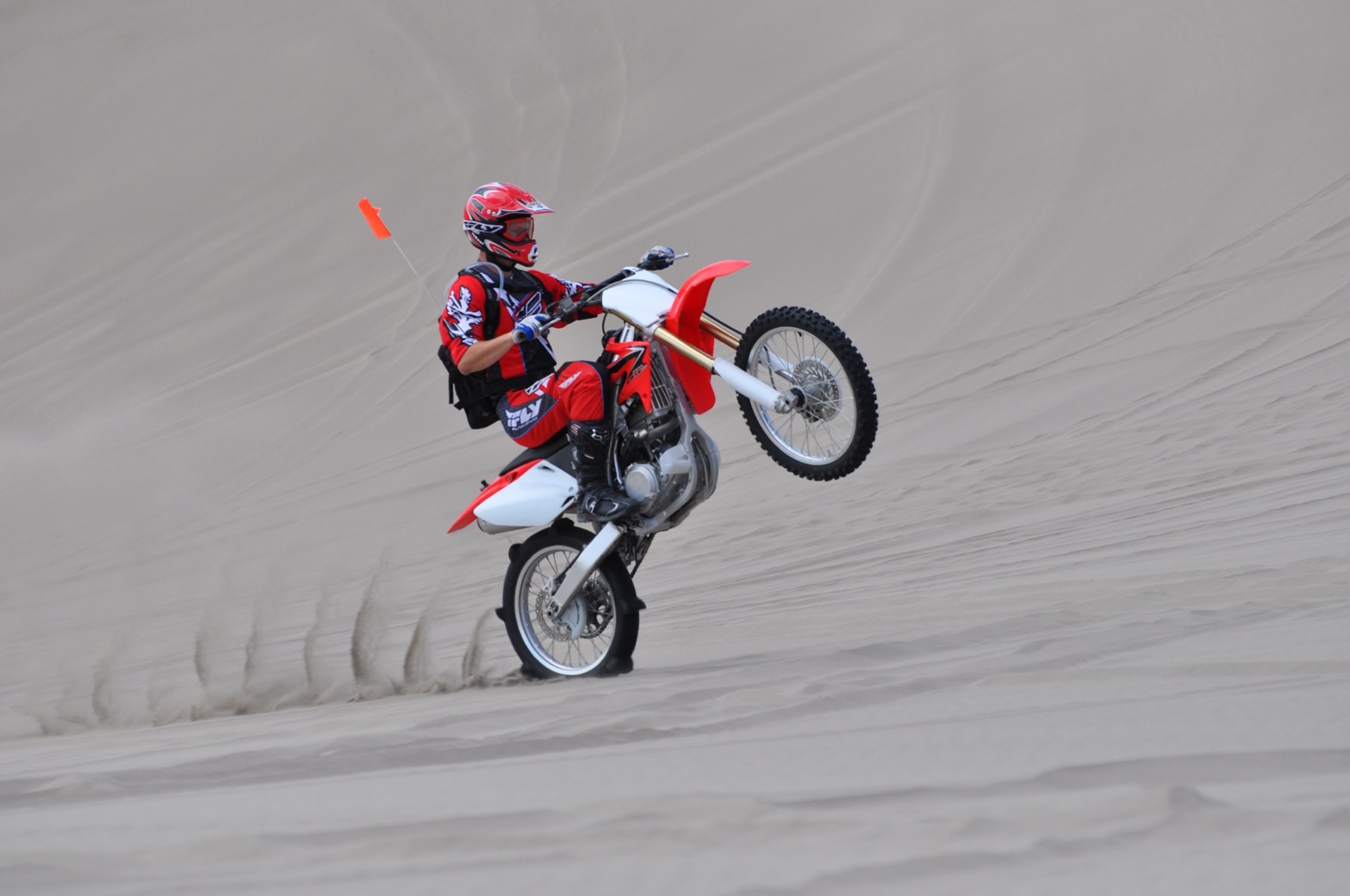 Dirt bike wheelie on the Saint Anthony Sand Dunes
