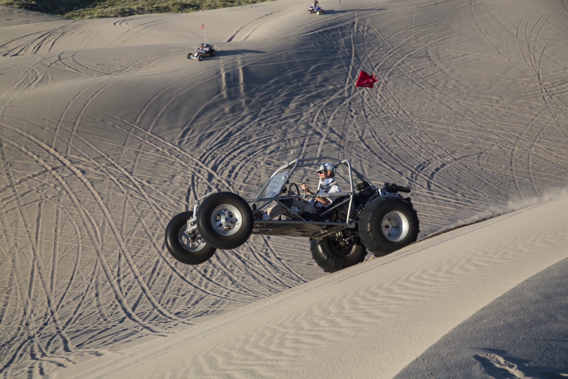 Sand rail cresting a dune at Saint Anthony Sand Dunes