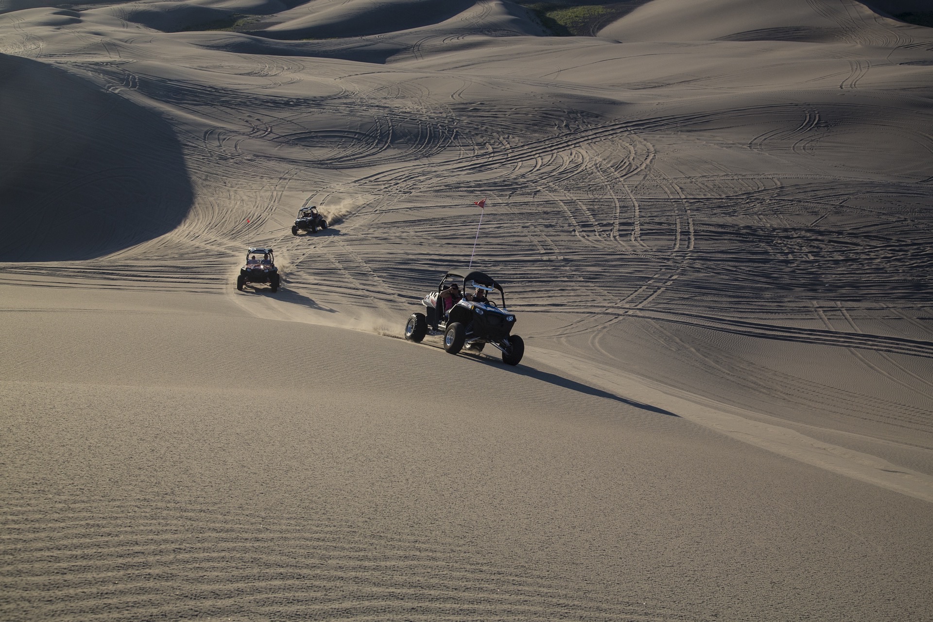 Side-by-sides riding ridges at the Saint Anthony Sand Dunes