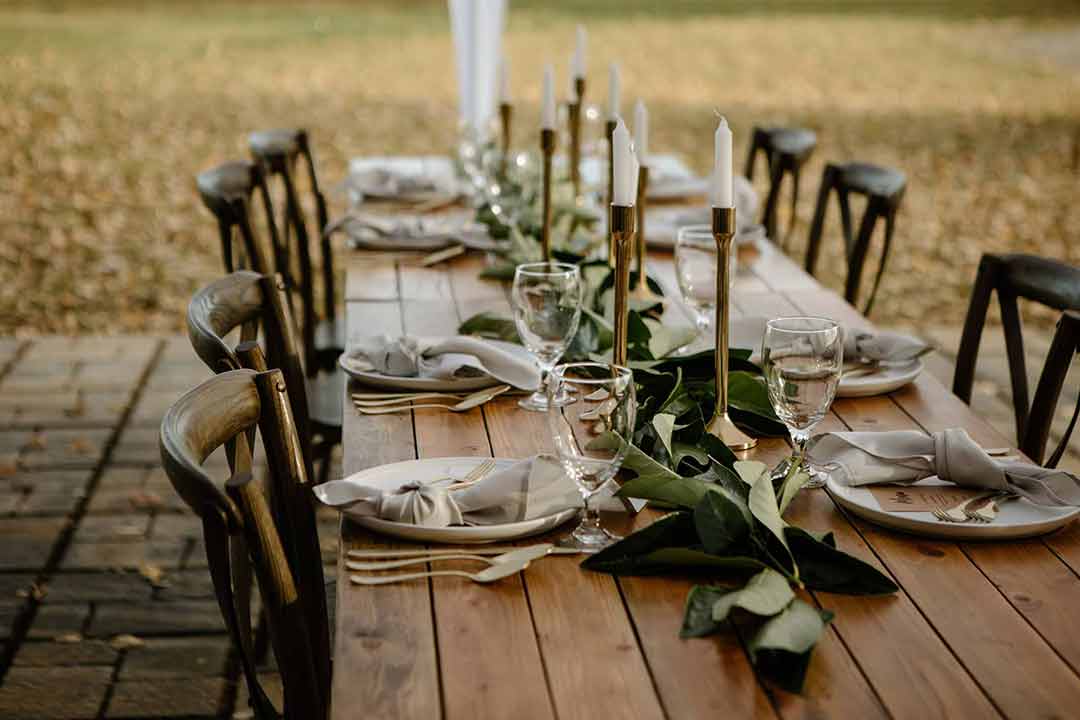 Long outdoor farm table place settings